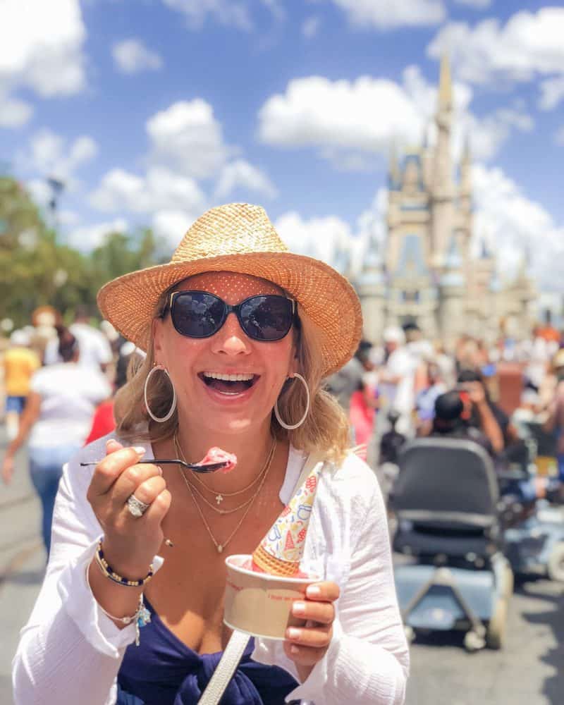 Girl eating ice cream in Disney Main street